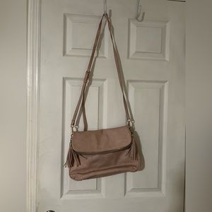Pale pink faux leather bag. No label